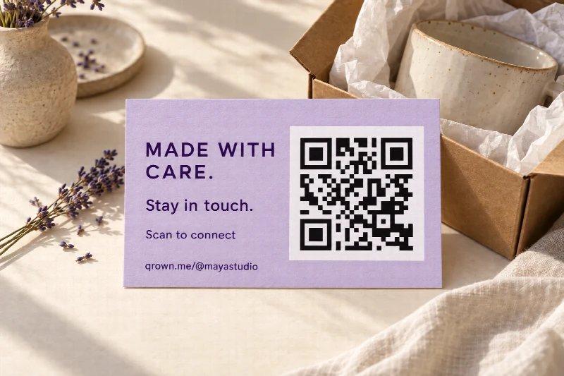 A lavender thank-you card with a scannable QR code, Scan to connect, and qrown.me/@mayastudio beside handmade ceramics.